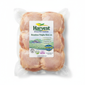 Vacuum-sealed skin-on chicken thighs with Harvest Poultry label